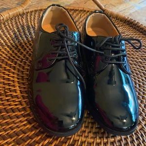 Tip Top little boys black dress shoes.